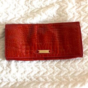 Coco print leather clutch